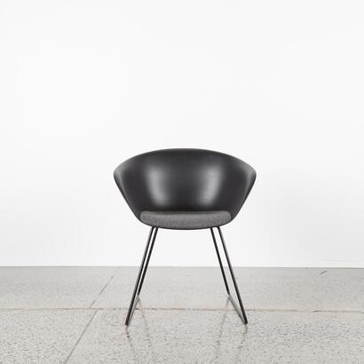A Modern Black Tub Chair With Sleigh Base