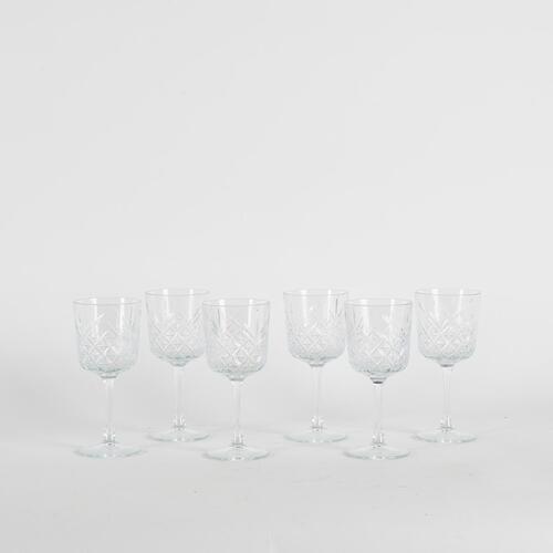 A Set Of Six Cut Glass Patterned Wine Glasses