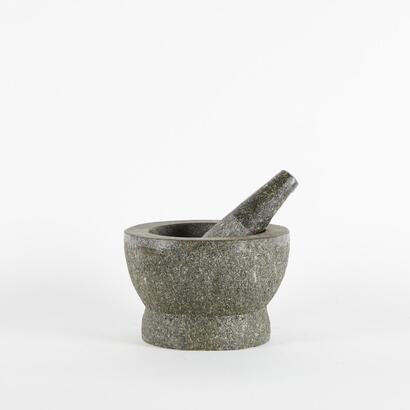 A Large Stone Mortar And Pestle