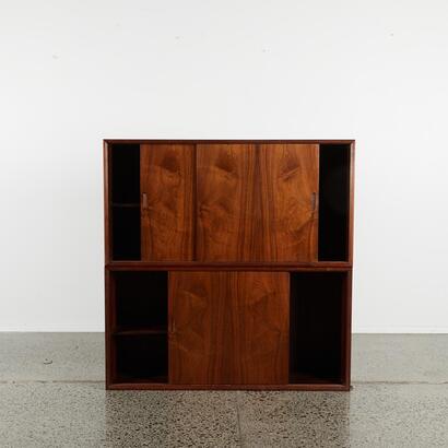 A Pair Of Rosewood Cabinets With Sliding Doors