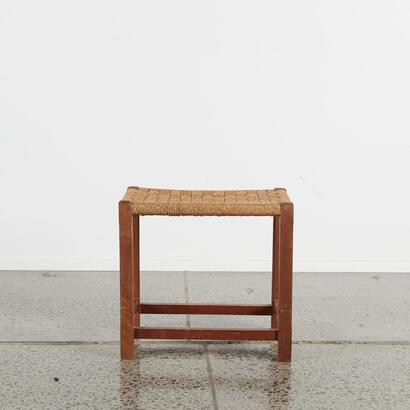 A Vintage Wooden Foot Stool With Woven Top