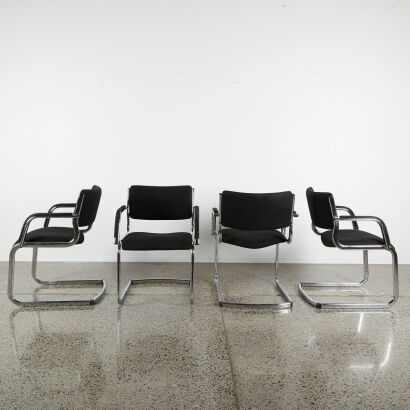 A Set Of Four Chrome Frame Cantilever Chairs In Black Fabric