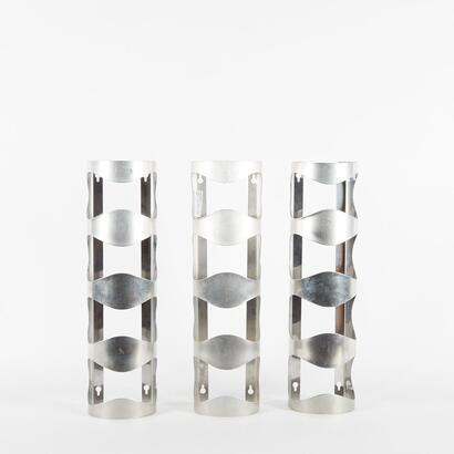 A Trio Of Stainless Steel Wall Mounted Wine Bottle Holders