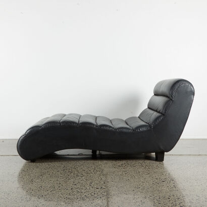 A Large Black Leather Chaise Longue