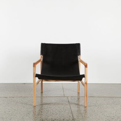 A Hyde Leather Slingback Chair With Oak Frame