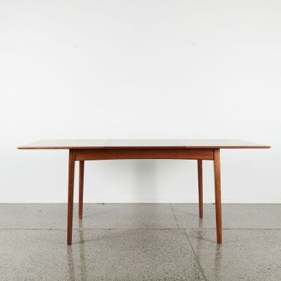 A Mid-Century Extendable Dining Table