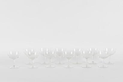 A Set Of Twelve Etched Glass Champagne Saucers