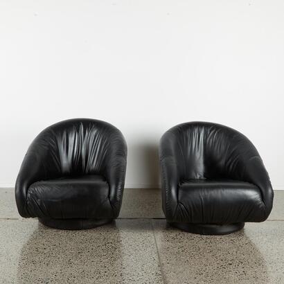 A Pair of Black Leather Tub Chairs