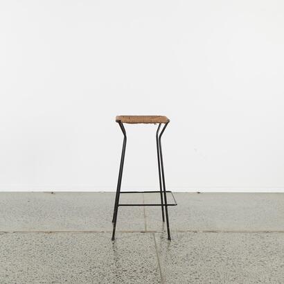 A Mid-Century Black Metal And Cord Bar Stool