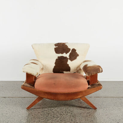 A 50s Banana Style Armchair In Cowhide