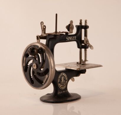 A Vintage Miniature Singer Sewing Machine