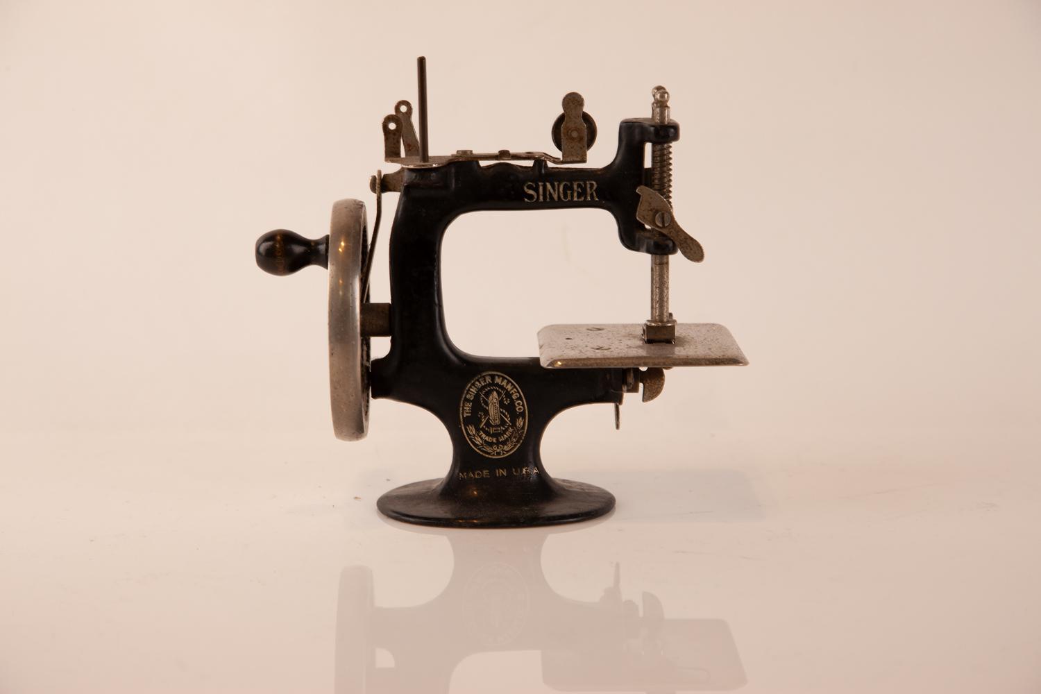 A Vintage Miniature Singer Sewing Machine