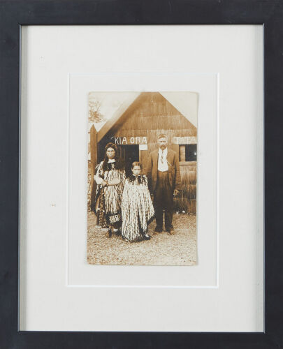 PHOTOGRAPHER UNKNOWN Māori Family Outside Whare Iti