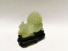 A Chinese Light Green Jade Carving of Lion Dog with Wooden Base - 2