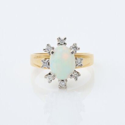 18ct Yellow Gold, 10mm x 7.6mm Opal and Diamond Halo Ring