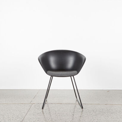 A Modern Black Tub Chair With Sleigh Base