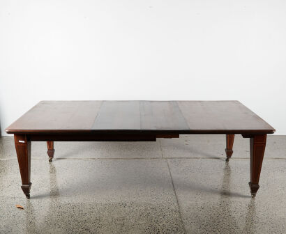 A Regency Extendable Dining Table With Inlay Legs