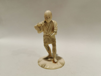 A Japanese Ivory Carving of a Farmer