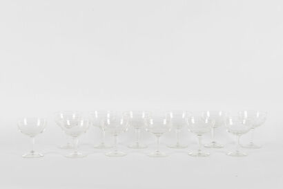 A Set Of Twelve Etched Glass Champagne Saucers