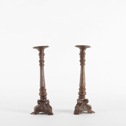 A Pair Of Vintage Gothic Polished Cast Iron Candle Holders