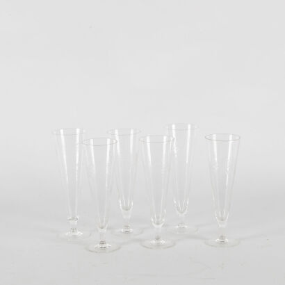 A Set Of Six Floral Etched Vintage Champagne Flutes