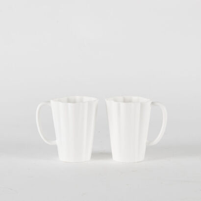 A Pair Of Fluted White Coffee Cups