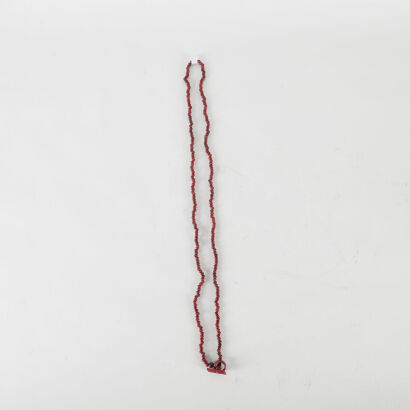 A Red Bead Necklace With Fob Catch