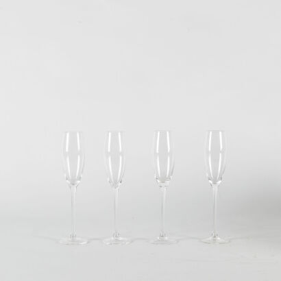 A Set Of Four Tall Champagne Flutes