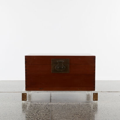 A Chinese Chest on a Lucite Base