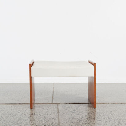 A Mid-Century Footstool With Cream Vinyl Top