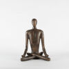 A Large Bronzed Cement Yoga Statue