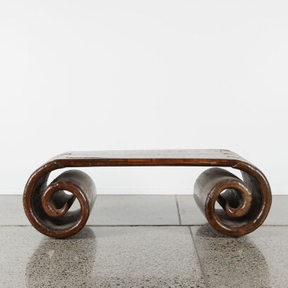 An Antique Table with Scroll Design