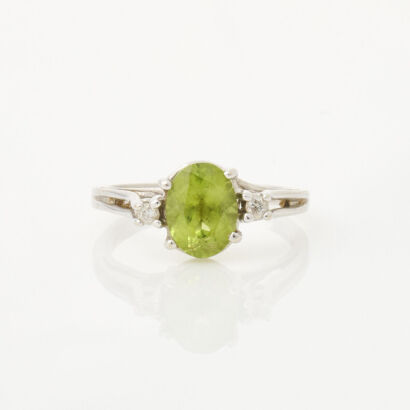 14ct White Gold, 1.20ct Oval Peridot and Diamond Three Stone Ring