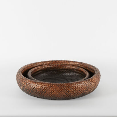 A Pair Of Large And Small Cane Weaved Bowls