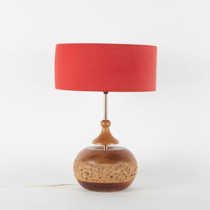 A Mid-Century Table Lamp With Red Shade And Solid Wood And Cork Base