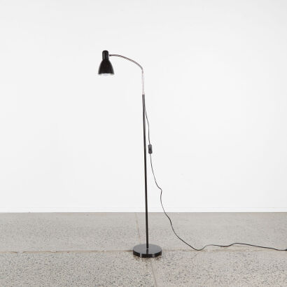 A Gooseneck Floor Lamp In Black And Silver