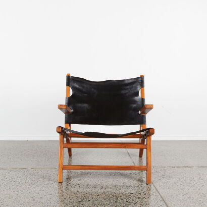 A Leather And Teak Slingback Lounge Chair