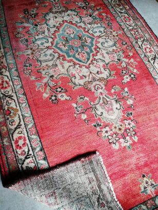 A Hand Knotted Iranian Wool Rug