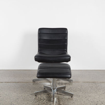 A Black MCM Swivel Chair With Footstool