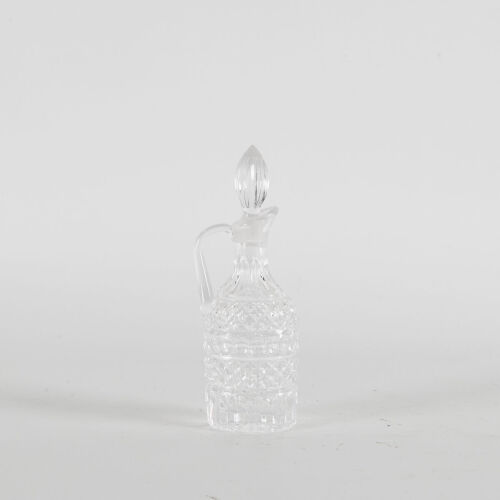 An Intricite Glass Decanter With Stopper