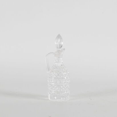 An Intricite Glass Decanter With Stopper