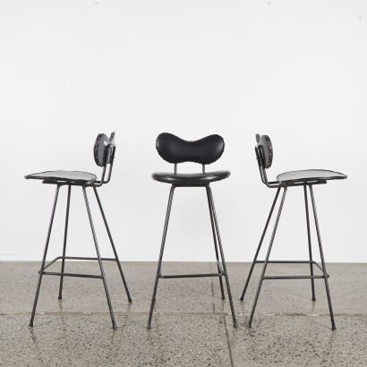 A Set Of Three Mid-Century Black Vinyl Bikini Bar Stools