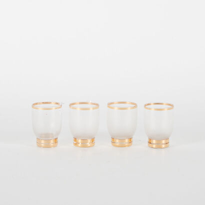 A Collection Of Four Small Shot Glasses