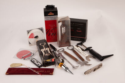 A selection of corkscrews, bottle openers & wine cellar neck tags in one lot