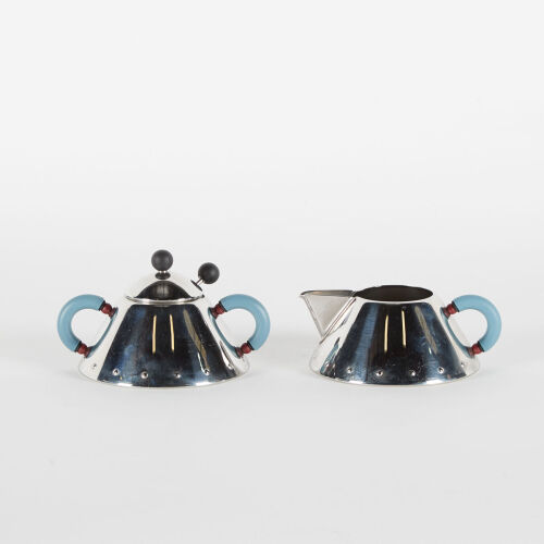 An Alessi Creamer And Sugar Bowl With Spoon By Michael Graves