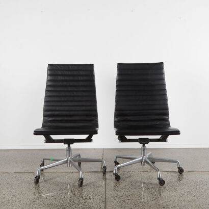 A Pair of Eames High-Back Group Chairs