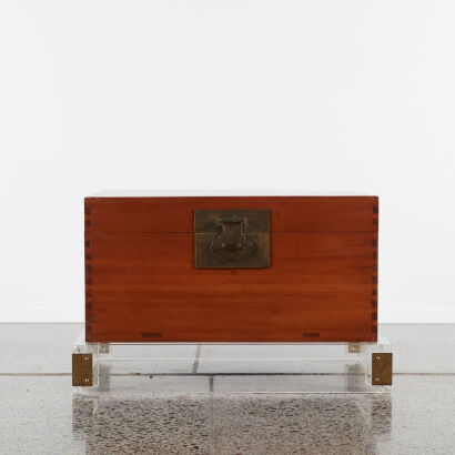 A Chinese Chest on a Lucite Base