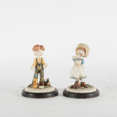 A Pair Of Vintage Resin Figurines