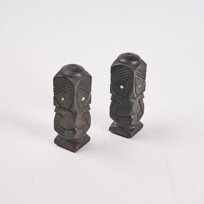 A Pair Of Carved Salt And Pepper Shakers