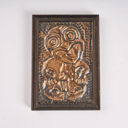 A Framed Pressed Copper Tiki